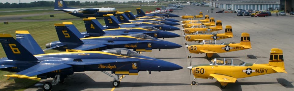 Lima Lima Flight Team flying in formation in Navy blue colors